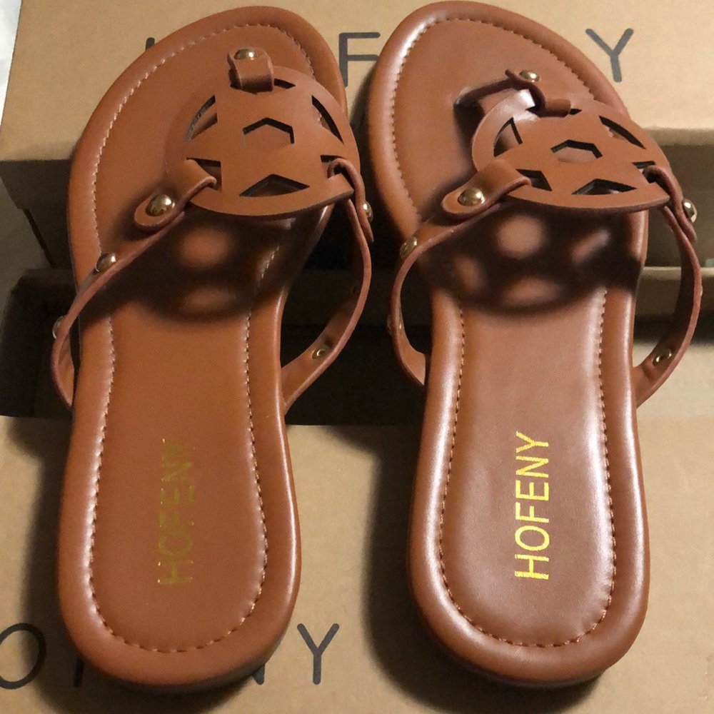 Dark tan sandals. 10 inches long, between size 8, and some size 9. Brand new.